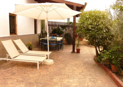 The front patio & alfresco dining area at Casa La Palmera, Arroyo Coche