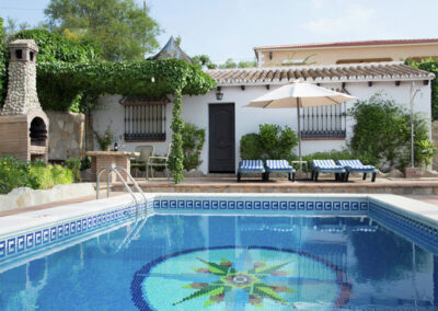 The barbecue area & swimming pool at Casa Los Lirios, Villanueva de la Concepción
