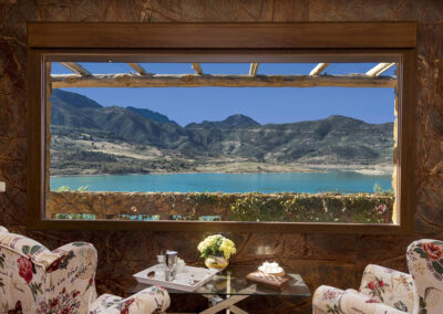 Enjoy lake vistas through the living area's large picture windows at El Dolmen de Alaju, El Gastor