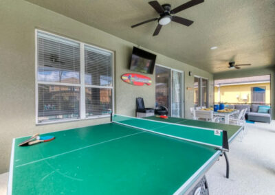 The covered lanai & alfresco dining area at Emerald Island Resort 18, Kissimmee