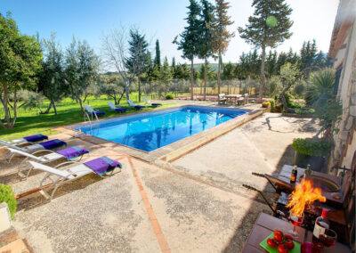 The barbecue area & swimming pool at Hacienda Los Olivos, Ronda
