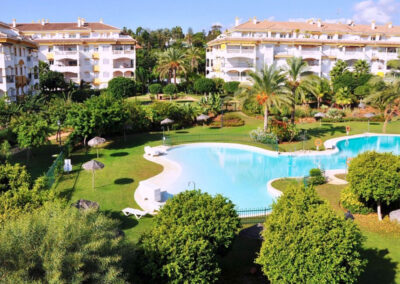 The resort swimming pool & gardens at La Dama De Noche, Nueva Andalucía