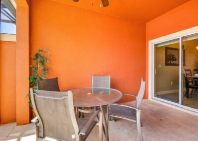 The covered lanai & alfresco dining area at Paradise Palms Resort 10, Kissimmee