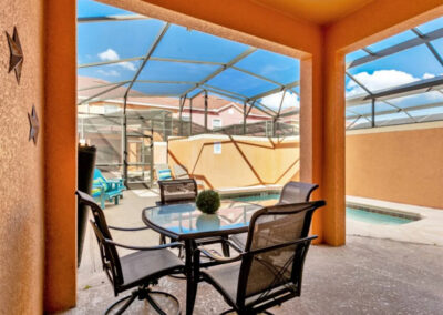 The covered lanai & alfresco dining area at Paradise Palms Resort 85, Kissimmee