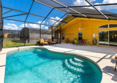 The swimming pool & alfresco dining area at Watersong Resort 50, Davenport